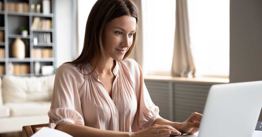 girl typing on laptop