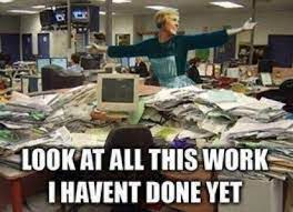 Meme with text "Look at all this work I haven't done yet" and a lady standing on a desk with thousands of paper everywhere