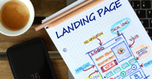 landing page drawn out on a piece of paper with a coffee mug in the shot