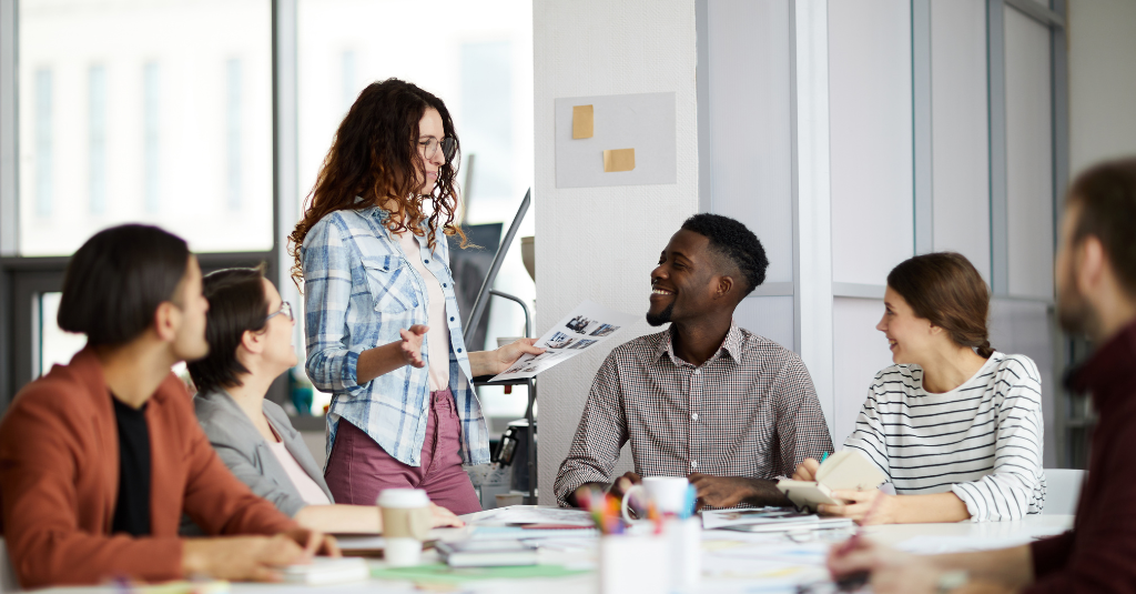 Woman speaking to a group of her colleagues